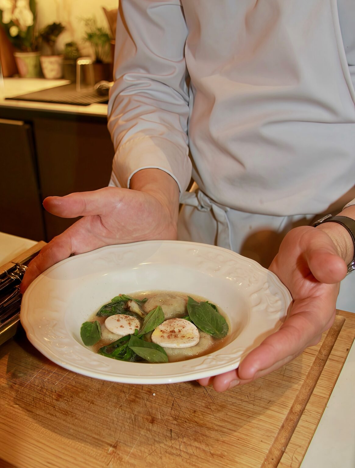 A Pr&eacute;mices chef at work in a private kitchen during a cooking class