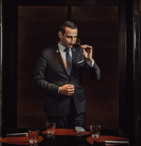 A Prémices sommelier at work during a private wine-pairing dinner in Paris